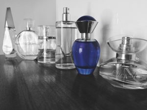 black and blue picture of perfume for the article how to tell if makeup is expired