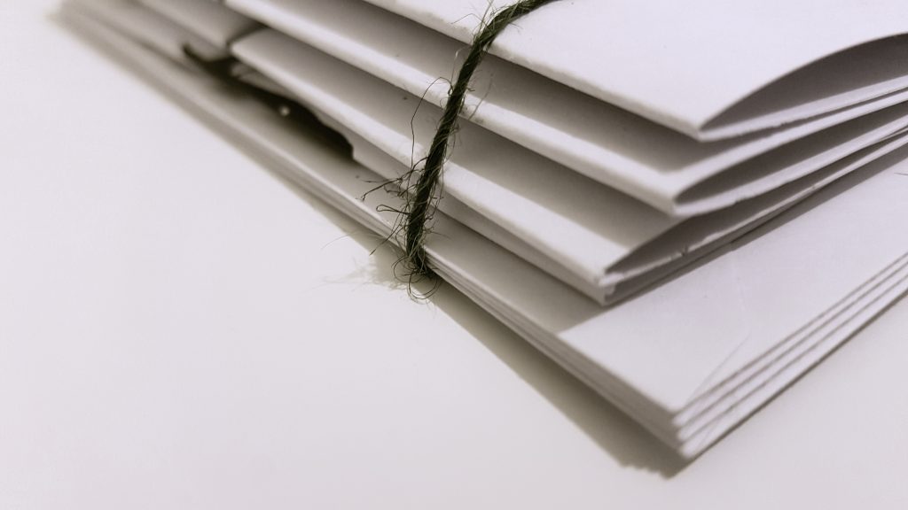 a picture of white folders containing the important documents checklist