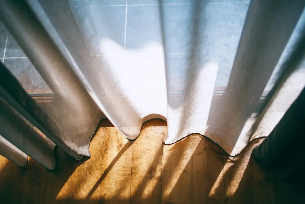 DIY Window Cornice, picture of a curtain with sun shadows