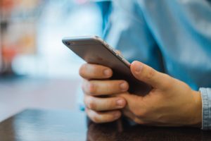 do i need phone insurance? a person looking at his cellphone